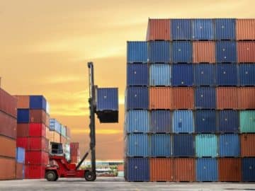 Crane handling container at port