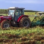 Groundnut Harvest Reveals India's Agrarian Story - Farmer tractor harvesting peanuts groundnuts