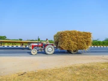 farmer harvest tractor grain straw full