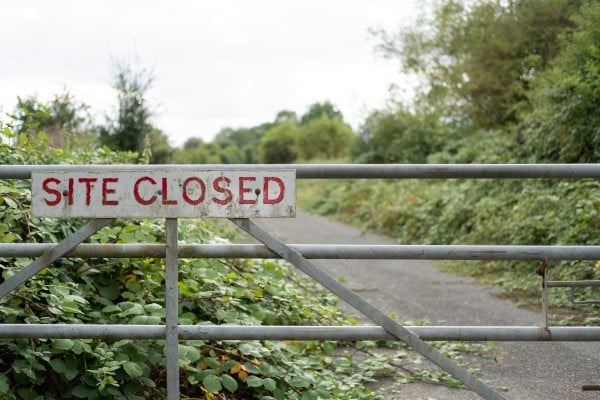 site closed sign road fence