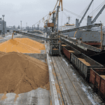 Grain loading operations at a Ukrainian export terminal showing wheat and corn shipments.